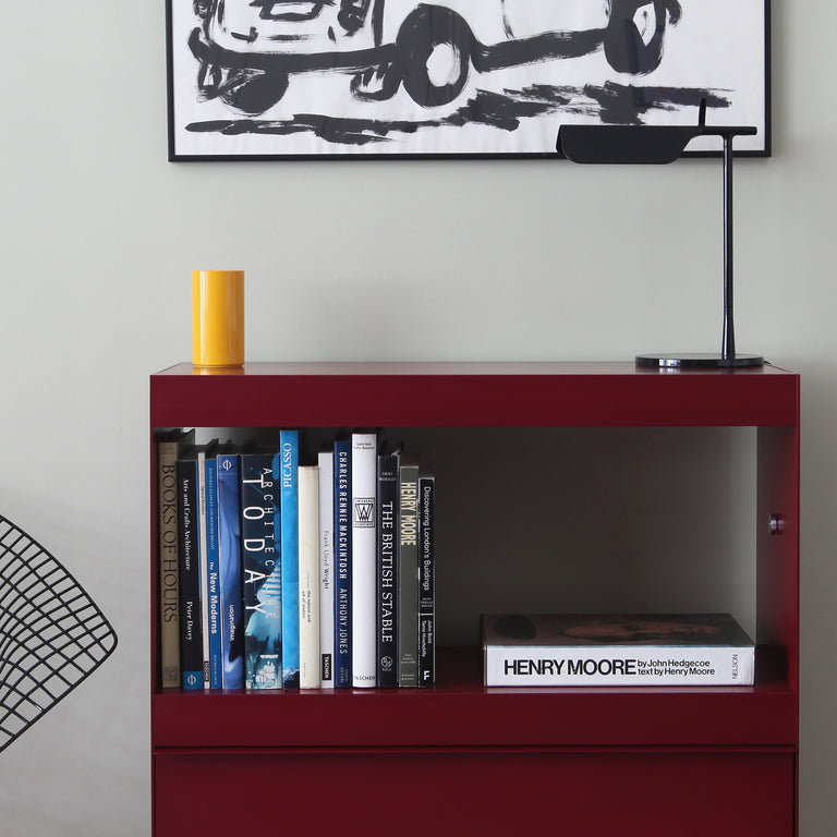 join modular shelving unit with large books in deep red