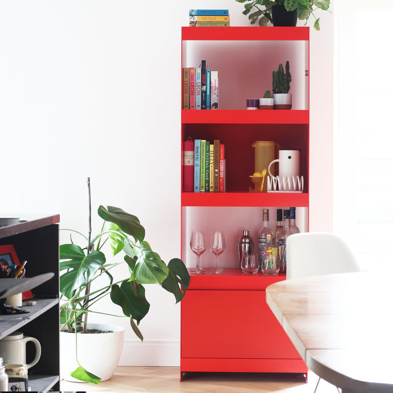 modern red tall shelving unit with cabinet door